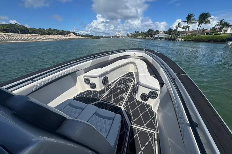  Yacht Photos Pics Luxurious 2016 Statement 380 Open boat interior with stylish seating and scenic waterway view.