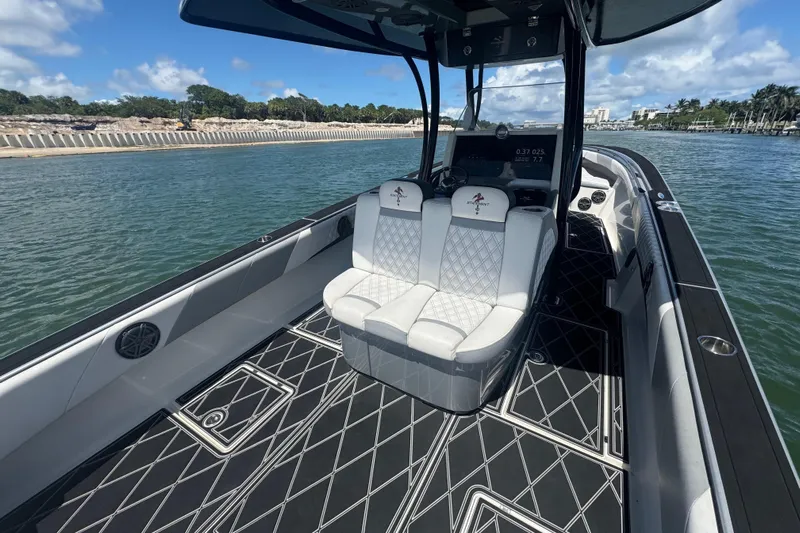 Yacht Photos Pics Luxury 2016 Statement 380 Open boat interior with stylish seating and sleek design on the water.