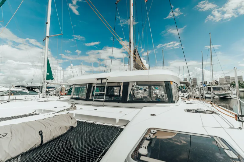 27 Reasons Yacht Photos Pics 2020 Excess 12 catamaran docked at marina under clear blue sky.