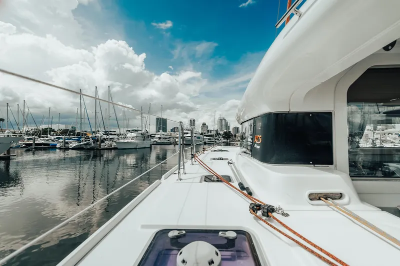 27 Reasons Yacht Photos Pics Sailing yacht Excess 12, 2020 model, docked in a marina with city skyline.