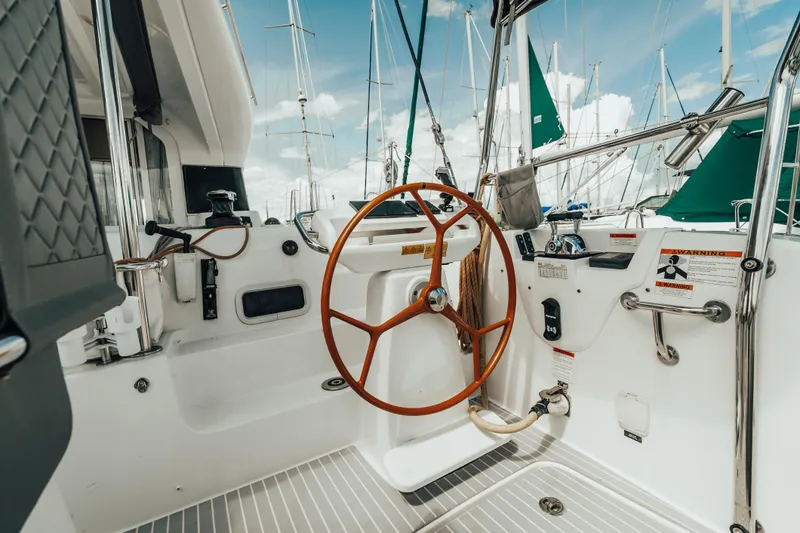 27 Reasons Yacht Photos Pics Cockpit of 2020 Excess 12 sailboat with wooden steering wheel and nautical controls.