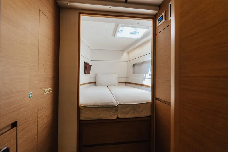 27 Reasons Yacht Photos Pics Cozy cabin interior of 2020 Excess 12 yacht with wooden finish and skylight.
