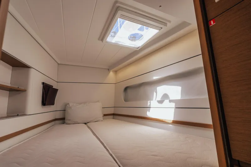 27 Reasons Yacht Photos Pics Cozy cabin interior of 2020 Excess 12 yacht with skylight and minimalist design.