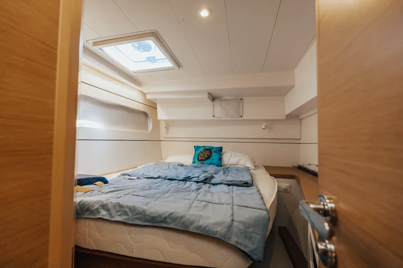27 Reasons Yacht Photos Pics Cozy cabin interior of 2020 Excess 12 yacht with skylight and comfortable bedding.