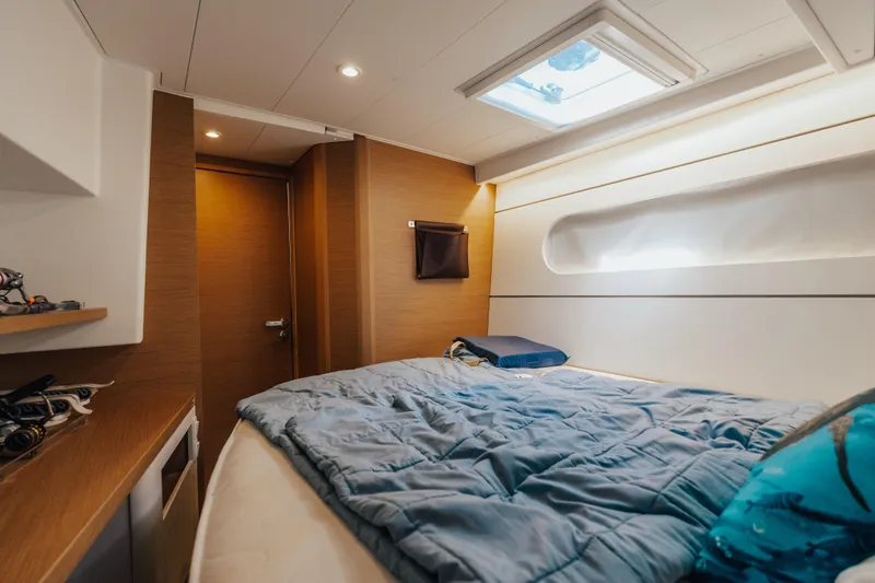 27 Reasons Yacht Photos Pics Luxurious cabin interior of 2020 Excess 12 yacht with skylight and cozy bedding.
