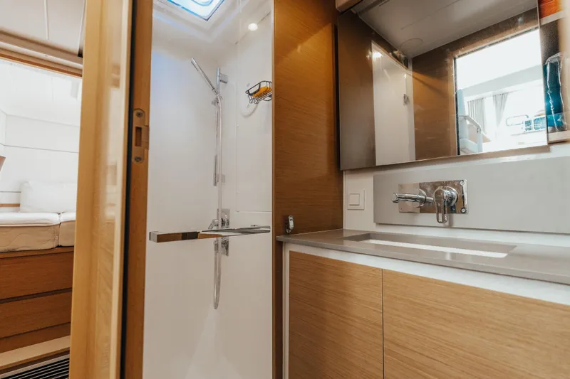 27 Reasons Yacht Photos Pics Modern bathroom interior in 2020 Excess 12 yacht, featuring sleek design and wooden cabinetry.