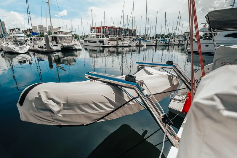 27 Reasons Yacht Photos Pics Marina with Excess 12 catamaran, 2020 model, docked among sailboats under clear sky.