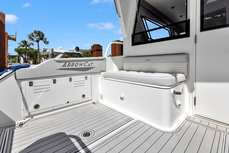 Transcendent Yacht Photos Pics 2023 ArrowCat Flybridge Dual Helm boat deck with seating and storage, featuring sleek design.
