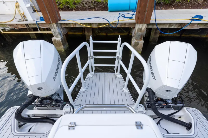 Transcendent Yacht Photos Pics 2023 ArrowCat Flybridge Dual Helm with twin Mercury outboard engines at dock.