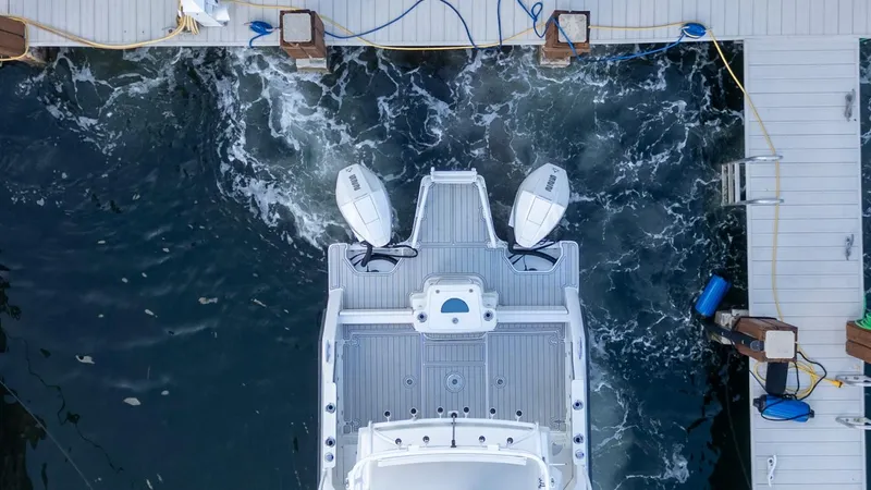 Transcendent Yacht Photos Pics Aerial view of 2023 ArrowCat Flybridge Dual Helm boat docked at marina.
