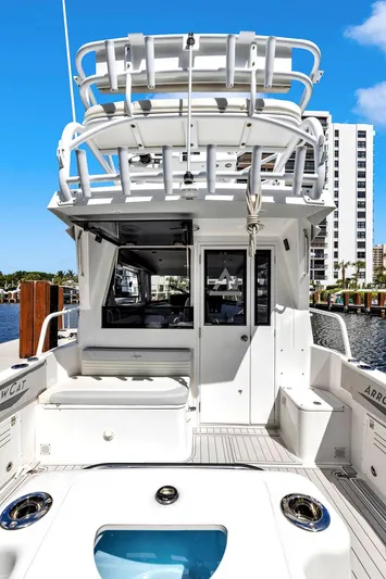 Transcendent Yacht Photos Pics 2023 ArrowCat Flybridge Dual Helm boat docked, showcasing rear view and upper deck.