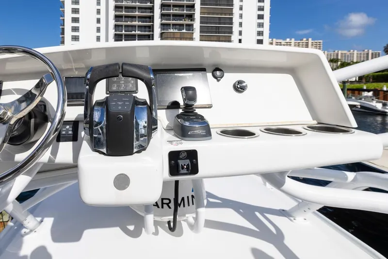Transcendent Yacht Photos Pics 2023 ArrowCat Flybridge Dual Helm with modern controls and cityscape background.