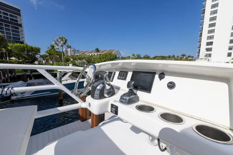 Transcendent Yacht Photos Pics 2023 ArrowCat Flybridge Dual Helm with modern controls and scenic marina view.