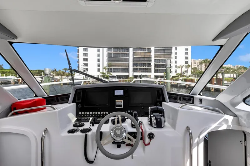 Transcendent Yacht Photos Pics 2023 ArrowCat Flybridge Dual Helm yacht interior with modern controls and waterfront view.
