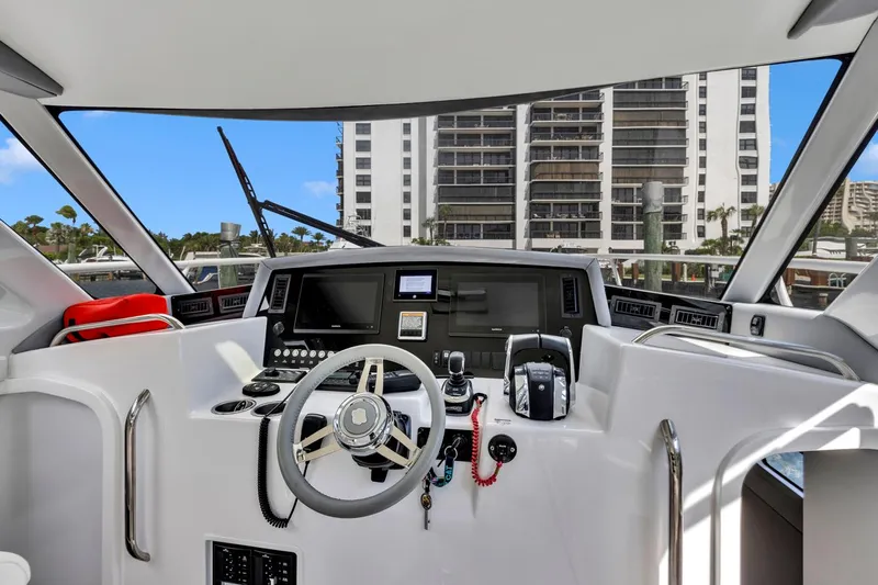 Transcendent Yacht Photos Pics 2023 ArrowCat Flybridge Dual Helm interior with modern controls and cityscape view.