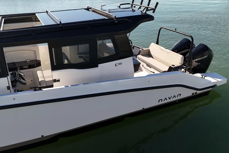  Yacht Photos Pics Navan C30 2026 boat with sleek design, dual Mercury engines, and modern interior on water.