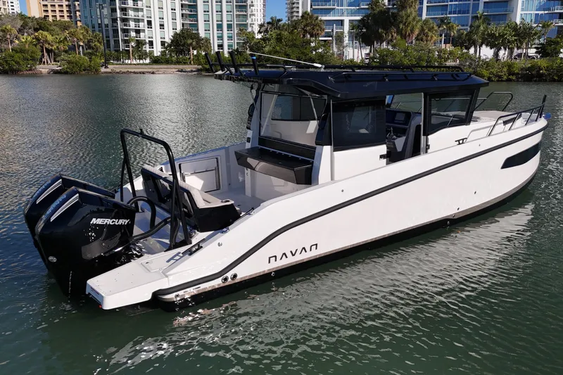  Yacht Photos Pics 2026 Navan C30 boat with dual Mercury engines on a calm waterway.