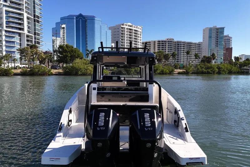  Yacht Photos Pics 2026 Navan C30 boat with dual engines on a city waterfront.