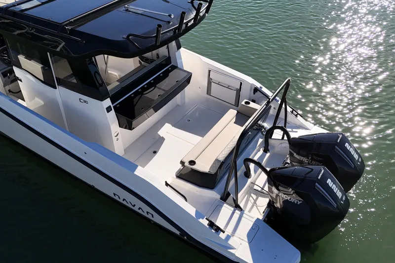  Yacht Photos Pics 2026 Navan C30 boat with dual Mercury engines on calm water.