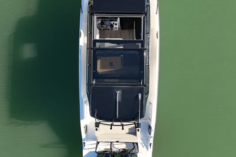  Yacht Photos Pics Overhead view of 2026 Navan C30 boat on calm green water.