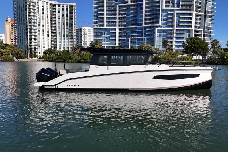  Yacht Photos Pics Navan C30 2026 boat on water with modern cityscape background.