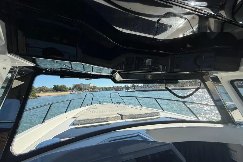  Yacht Photos Pics Interior view of 2026 Navan C30 boat, showcasing helm and waterfront scenery.