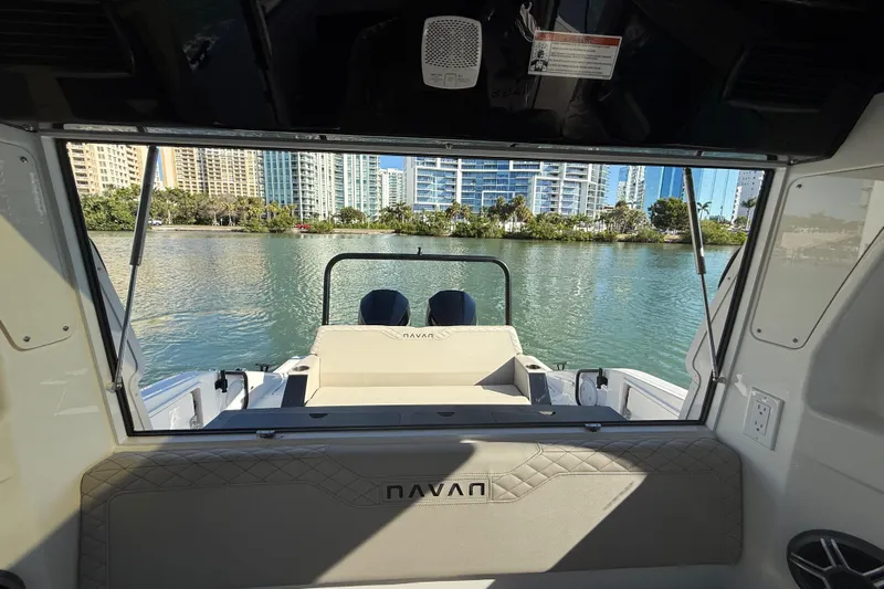  Yacht Photos Pics Interior view of 2026 Navan C30 boat overlooking waterfront cityscape.