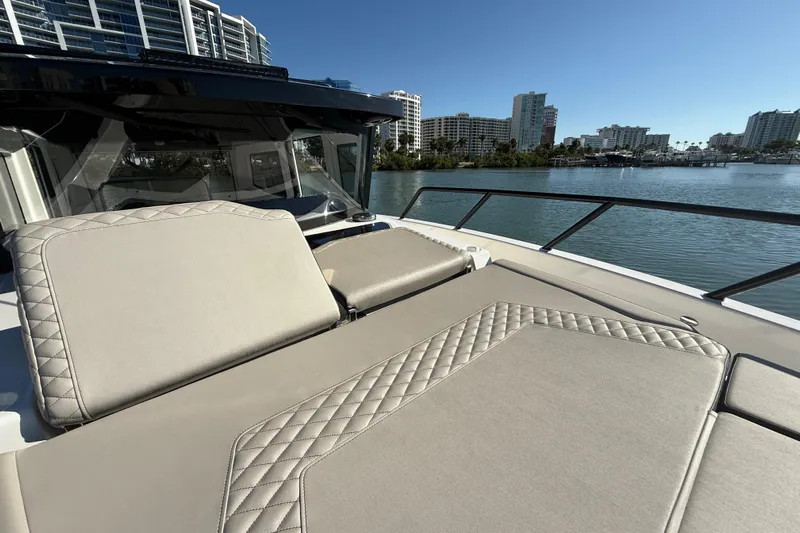  Yacht Photos Pics Luxurious 2026 Navan C30 yacht with elegant seating, overlooking serene waterfront and cityscape.