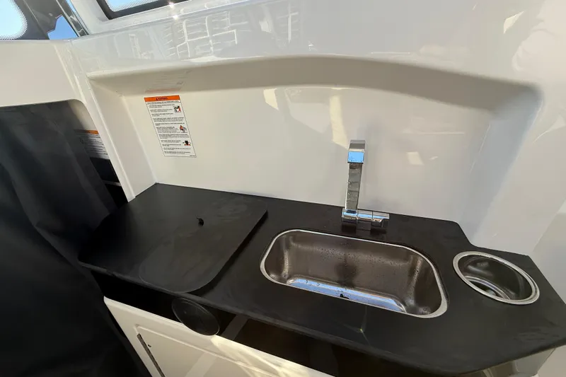  Yacht Photos Pics Compact kitchen sink area in 2026 Navan C30 with modern faucet and countertop.