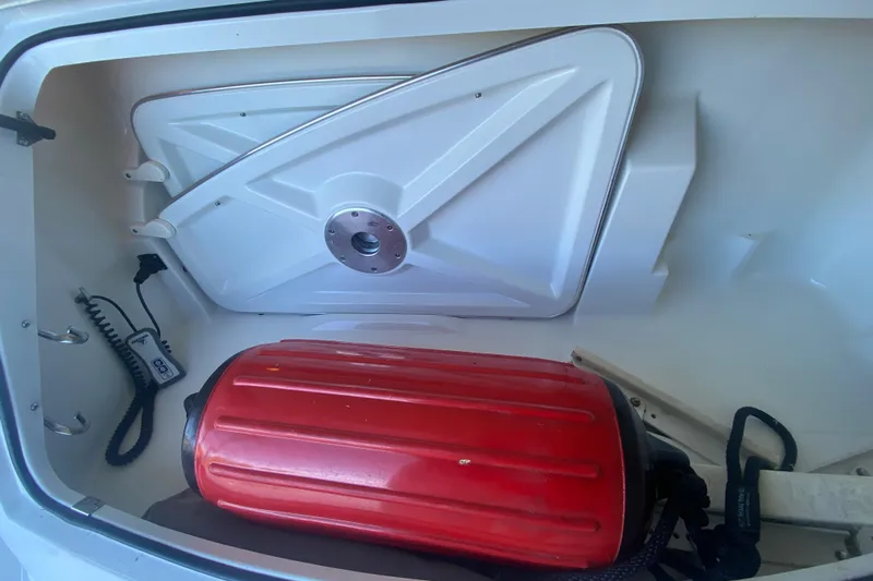  Yacht Photos Pics Storage compartment of a 2005 Formula 40 Performance Cruiser with red equipment inside.