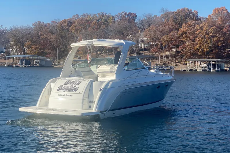  Yacht Photos Pics 2005 Formula 40 Performance Cruiser on a lake with autumn trees in the background.
