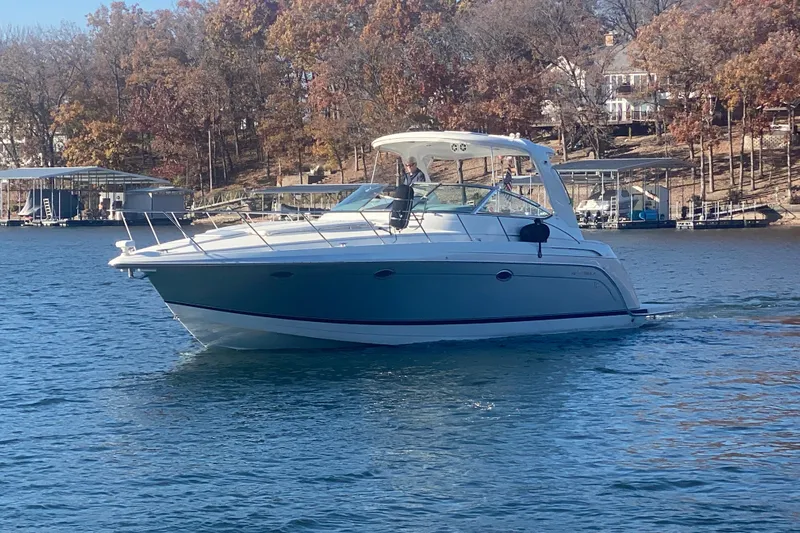  Yacht Photos Pics 2005 Formula 40 Performance Cruiser on a serene lake with autumn trees.