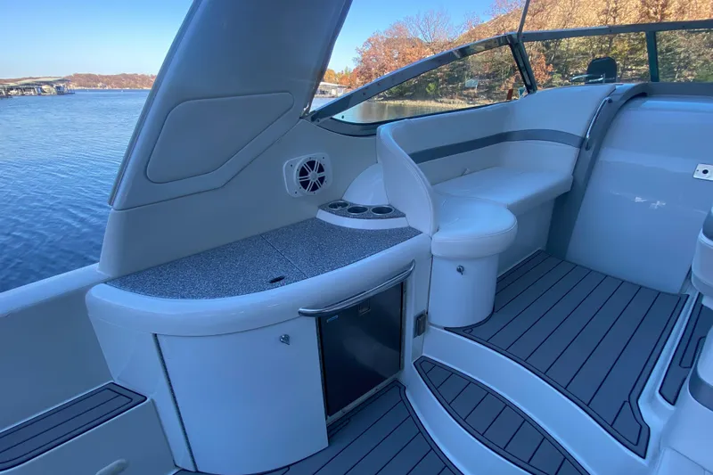  Yacht Photos Pics 2005 Formula 40 Performance Cruiser interior with seating and storage, overlooking a serene lake.