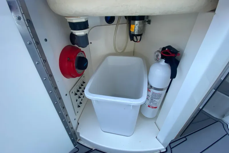  Yacht Photos Pics 2005 Formula 40 Performance Cruiser interior with fire extinguisher and storage bin.