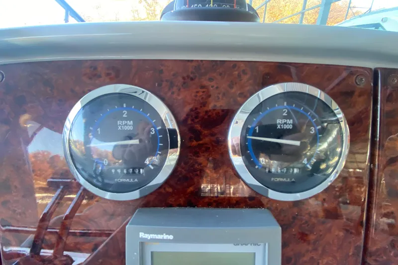  Yacht Photos Pics Dashboard of a 2005 Formula 40 Performance Cruiser with RPM gauges and Raymarine display.