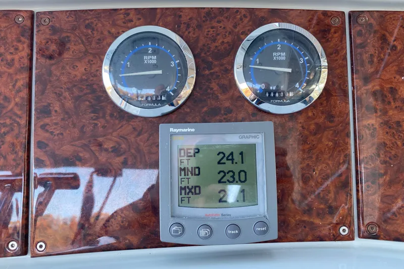  Yacht Photos Pics Dashboard of 2005 Formula 40 Performance Cruiser with RPM gauges and Raymarine display.