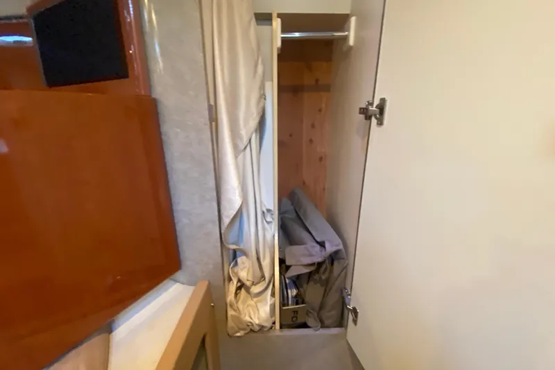  Yacht Photos Pics Interior closet of 2005 Formula 40 Performance Cruiser with storage items.