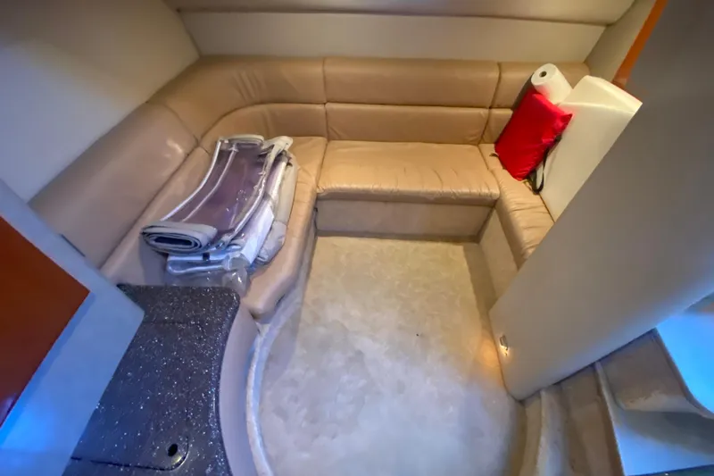  Yacht Photos Pics Interior of 2005 Formula 40 Performance Cruiser with beige seating and red pillow.