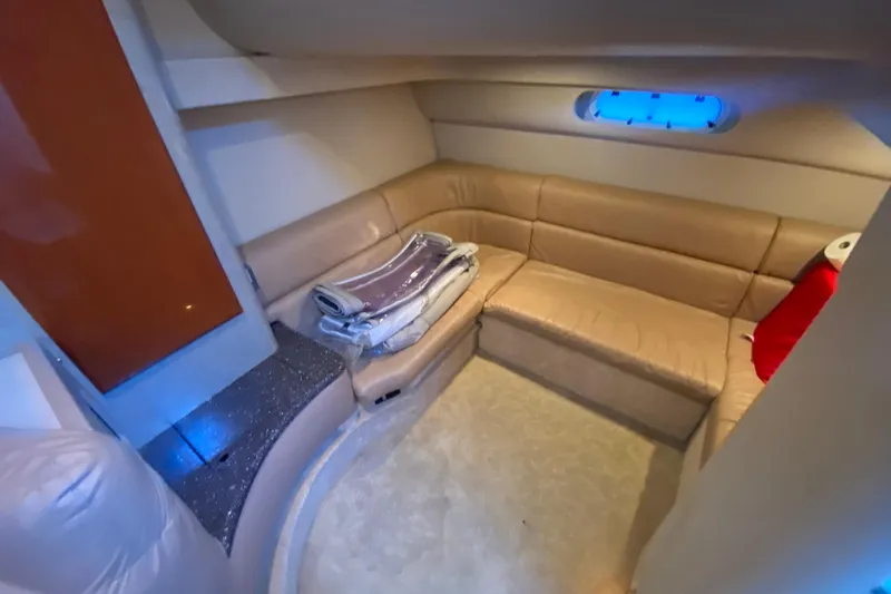  Yacht Photos Pics Interior of 2005 Formula 40 Performance Cruiser with beige leather seating and small window.