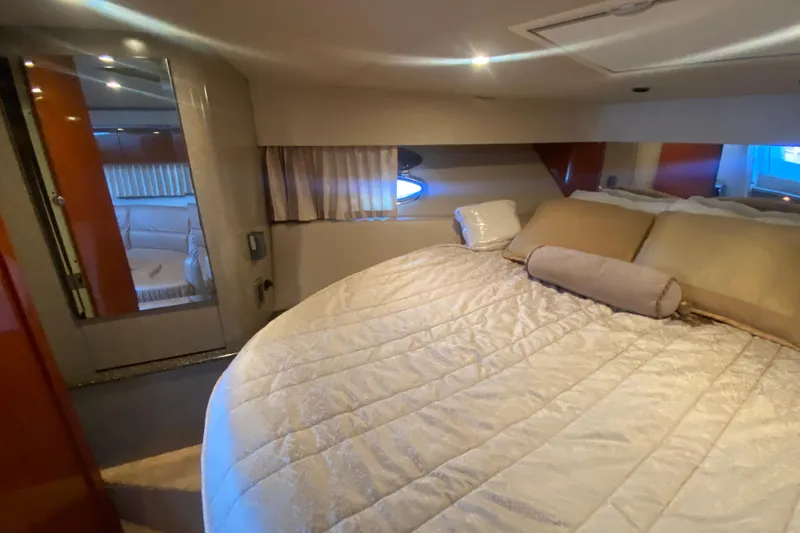  Yacht Photos Pics Luxurious interior of 2005 Formula 40 Performance Cruiser with cozy bed and elegant decor.