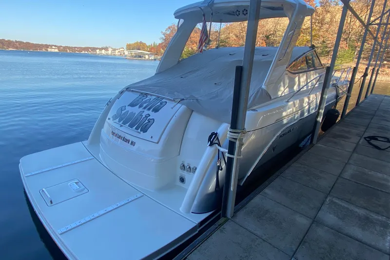  Yacht Photos Pics 2005 Formula 40 Performance Cruiser docked by a serene lake.
