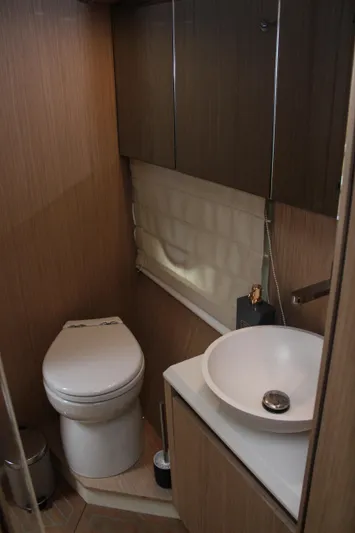 Oxygen Yacht Photos Pics 2016 Beneteau Monte Carlo 5 yacht bathroom with modern fixtures and wood accents.