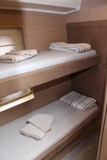 Oxygen Yacht Photos Pics Bunk beds in 2016 Beneteau Monte Carlo 5 yacht cabin, with neatly folded towels.