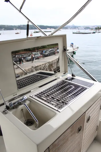 Oxygen Yacht Photos Pics Outdoor kitchen on 2016 Beneteau Monte Carlo 5 yacht with grill and sink.