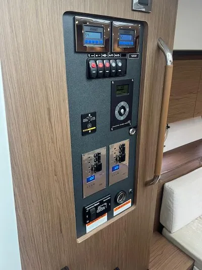  Yacht Photos Pics Control panel inside 2019 Beneteau Gran Turismo 40 yacht, featuring various switches and displays.