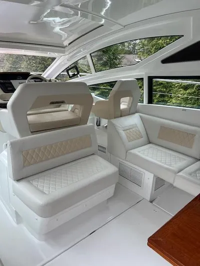  Yacht Photos Pics Luxurious interior of 2019 Beneteau Gran Turismo 40 yacht with elegant seating.