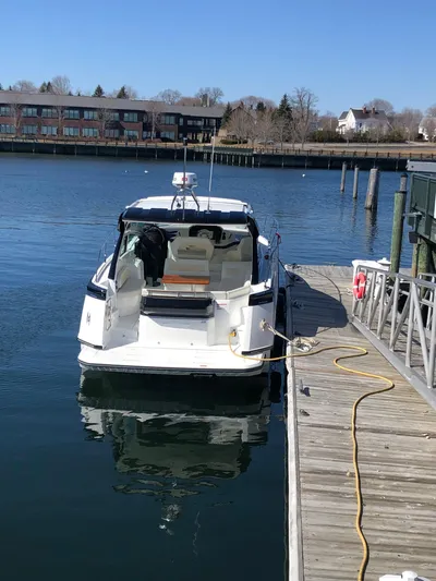  Yacht Photos Pics 2019 Beneteau Gran Turismo 41 docked at a marina on a sunny day.
