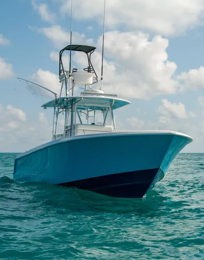+ Sea Keeper Yacht Photos Pics 2019 Contender 39 ST boat on open water under a cloudy sky.