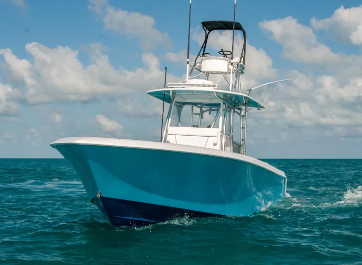 + Sea Keeper Yacht Photos Pics 2019 Contender 39 ST boat cruising on open water under a clear sky.