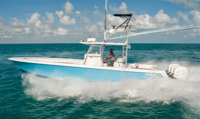 + Sea Keeper Yacht Photos Pics 2019 Contender 39 ST boat cruising on open water under a clear sky.